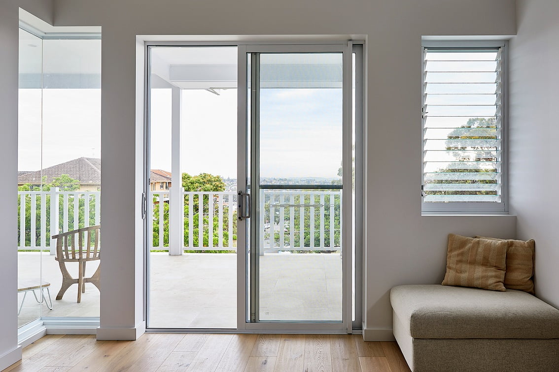 Ascend sliding door, louvre window and 90 degree corner join window in Pearl White