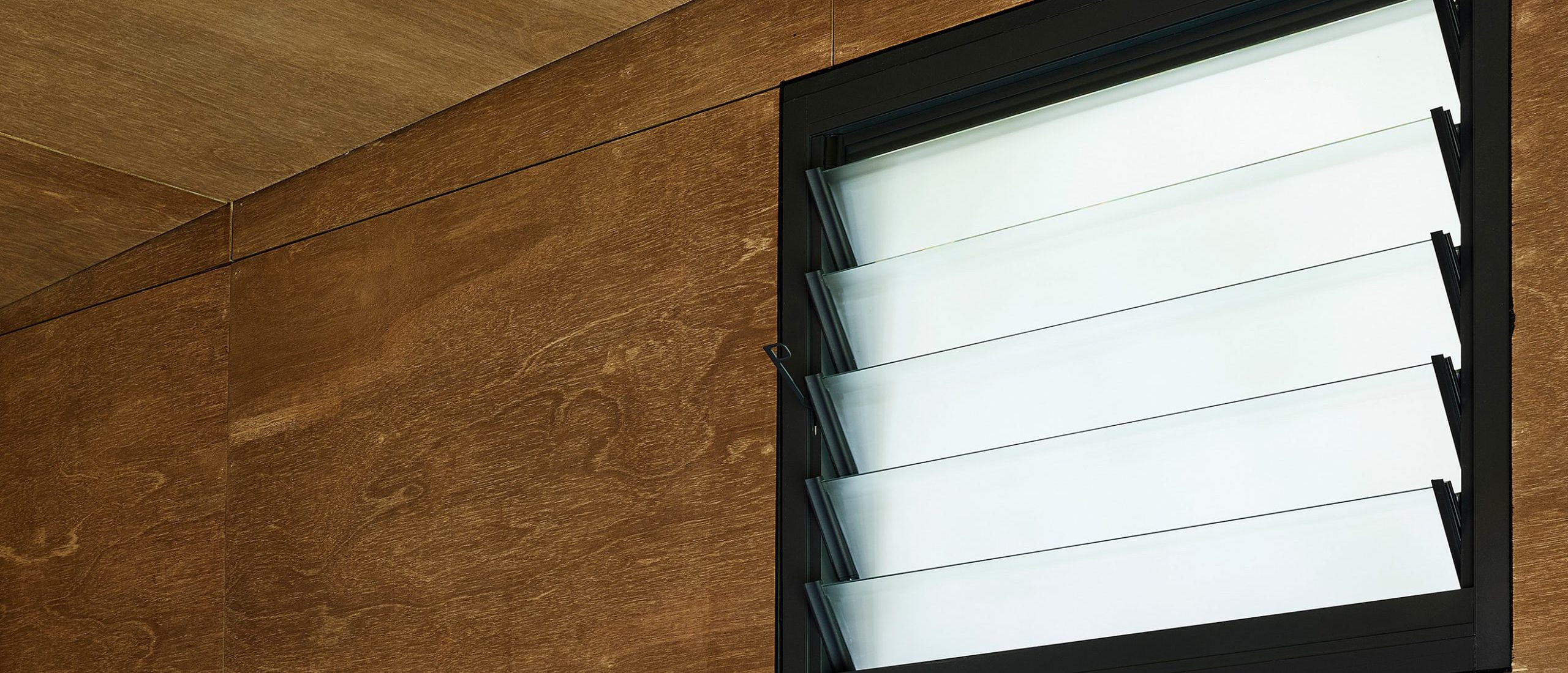 Paragon louvre window in Monument Matt with Lumina Cloud privacy glass