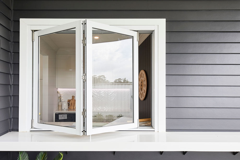 Paragon bi-fold window with sill in Pearl White