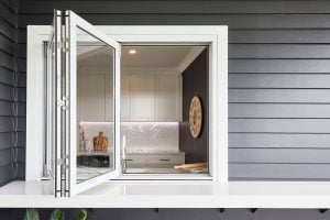 Paragon bi-fold window with sill in Pearl White