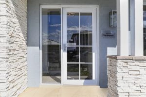 Paragon entry door with glazing bars and sidelight in Pearl White
