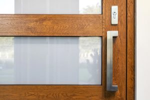 Atrium entry door and stainless steel Verta pull hardware