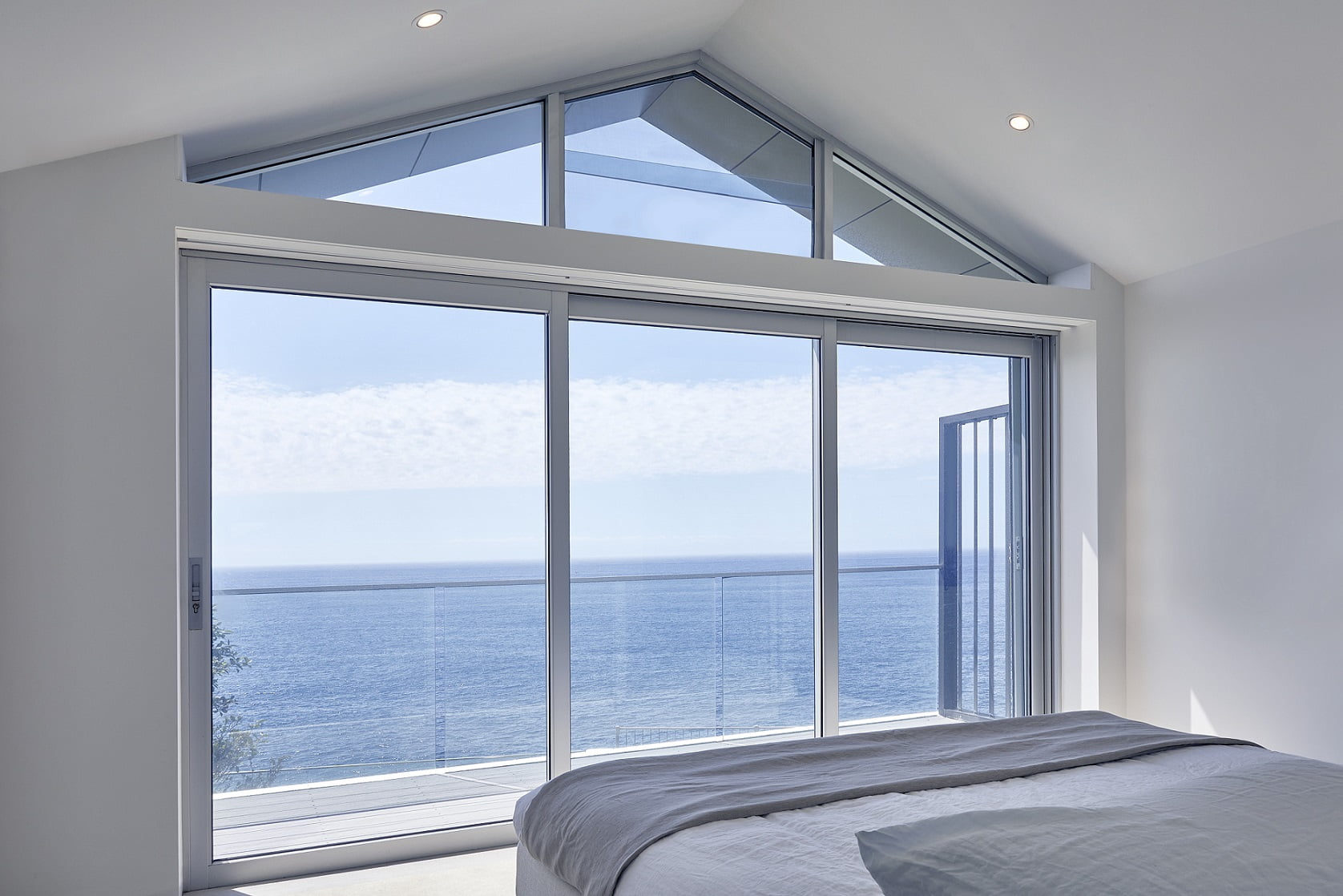 Bondi project: Paragon stacking door and rake window in clear anodised finish