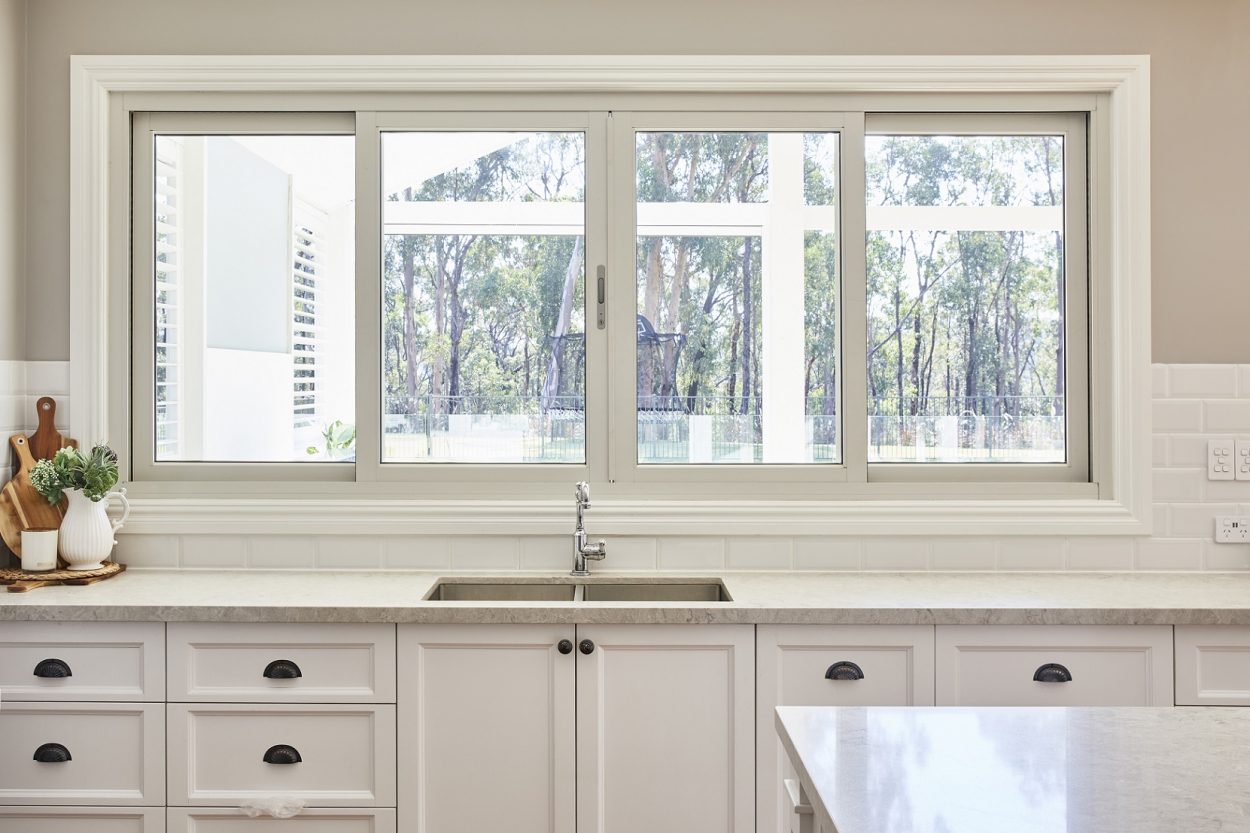 Paragon sliding window kitchen servery with silver hardware, Yellow Rock project