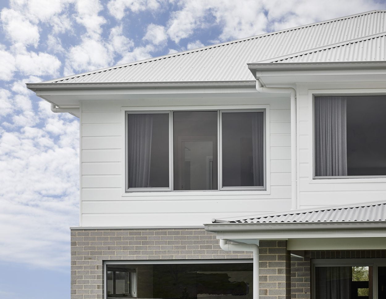 2nd storey home in clad finish with Horizon awning windows in Shale Grey