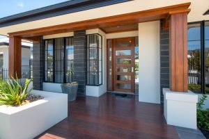 Natura timber entry door and sidelites with Horizon awning windows