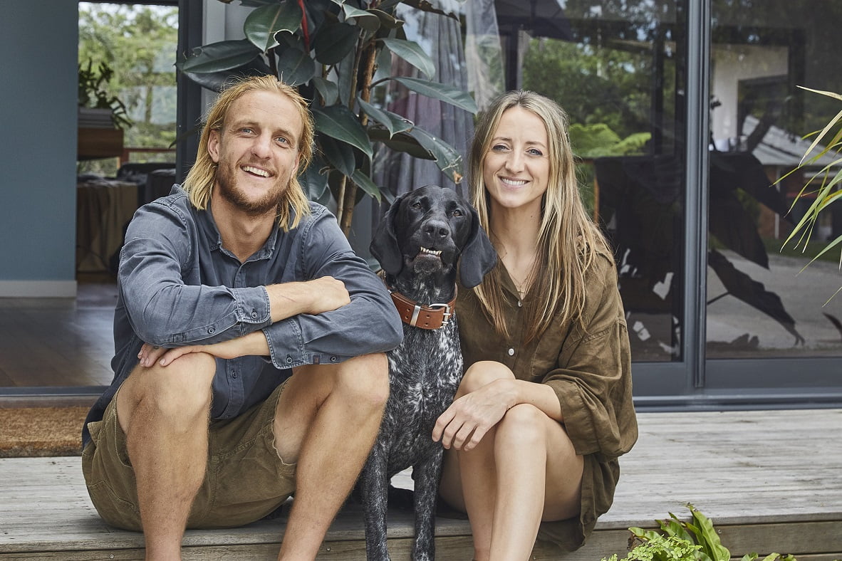 Couple with beautiful smiling dog