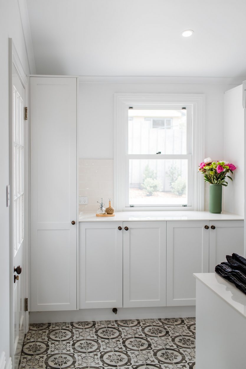 Natura timber double hung window in laundry, primed white