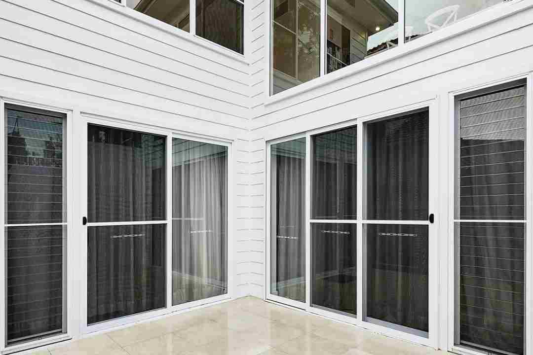 Exterior view of feature Louvre windows on a white building